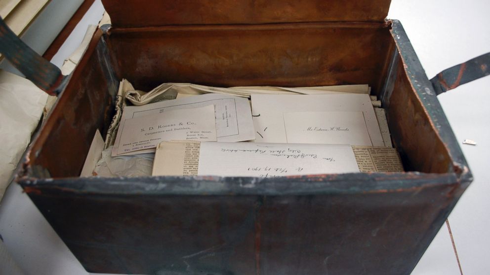 Items are stacked inside a shoebox-sized 1901 time capsule in Boston, Mass. in a photo released on Oct. 15, 2014. The capsule contained letters, photographs, newspaper clippings and the book "Foreign Relations of the United States, 1986."