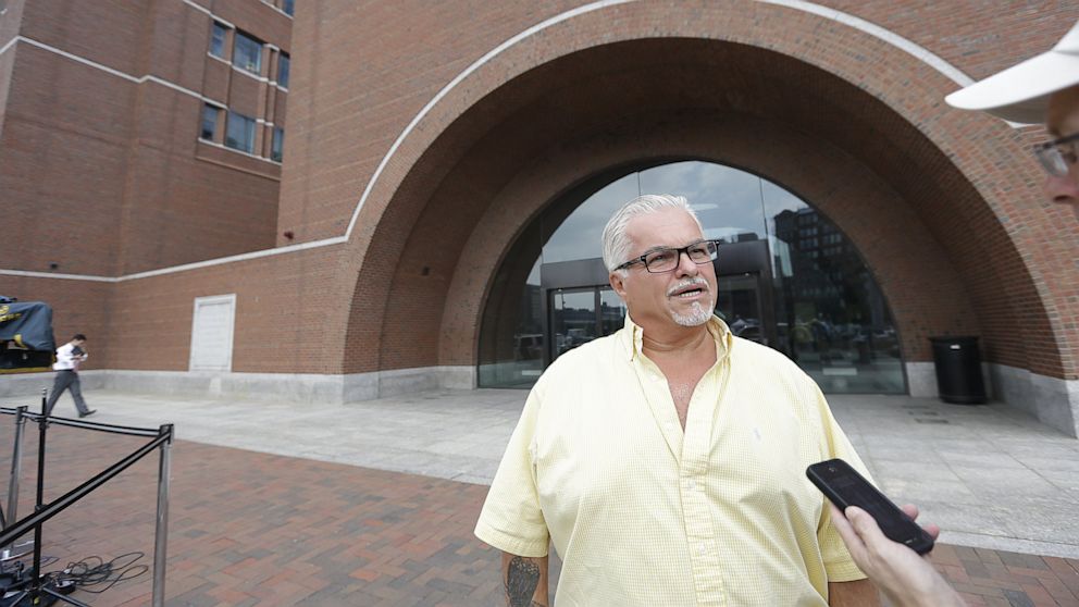 Steve Davis, brother of alleged murder victim Debra Davis, answers a reporter's question outside federal court,  July 8, 2013, in Boston, after the day's court session of the James "Whitey" Bulger trial concluded.