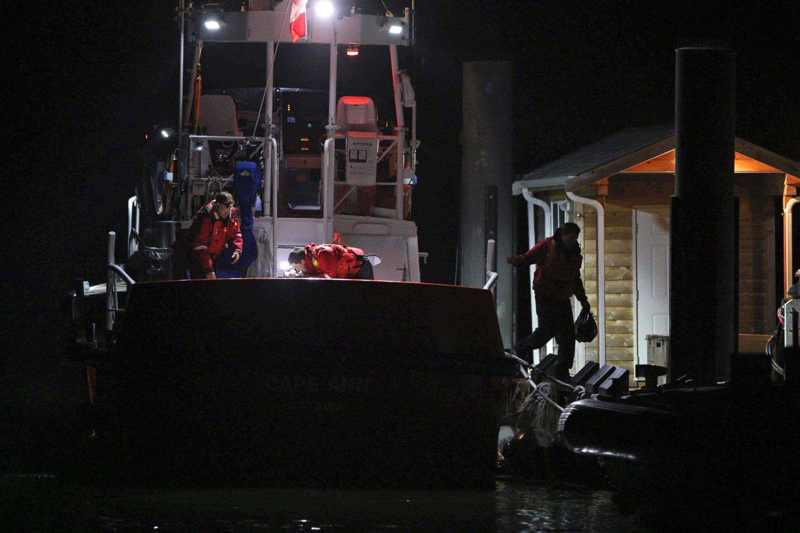PHOTO: Canadian Coast Guard crew arrive at a dock in Tofino, west coast of Vancouver, Canada, early on Oct. 26, 2015, following a search and rescue operation.