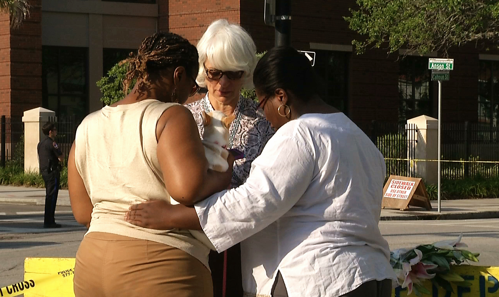 PHOTO: In this image taken from video on June 18, 2015, Tarsha Moseley, left, Martha Watson, and Toby Smith pray at a makeshift memorial near Emanuel AME Church in Charleston, S.C. 