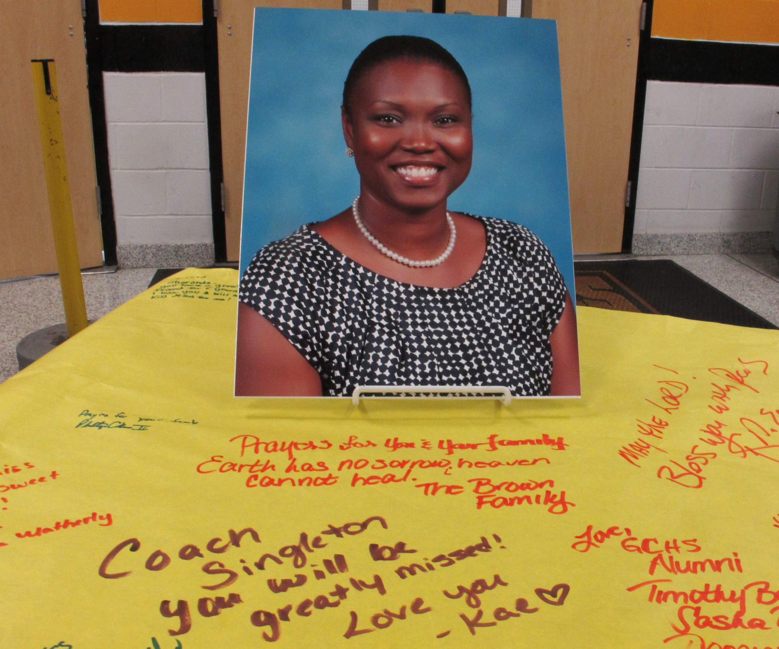 PHOTO: A picture of Sharonda Coleman-Singleton sits on paper signed by students, teachers and friends on June 18, 2015, in Goose Creek, S.C.