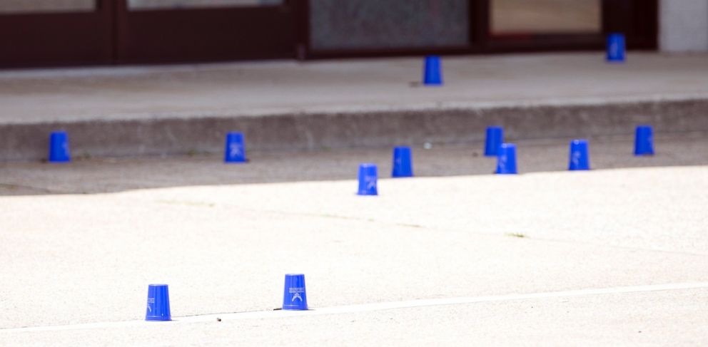 PHOTO: Plastic cups mark evidence outside the Armed Forces Career Center after a gunman open fire on the building, July 16, 2015, in Chattanooga, Tenn.