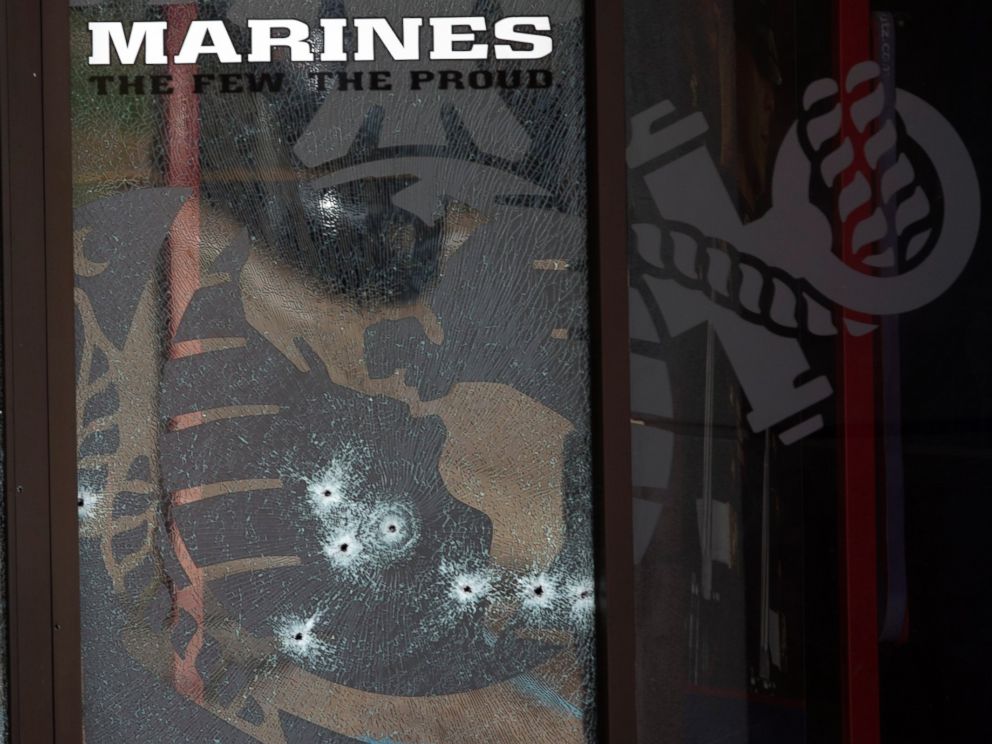 PHOTO: The glass window of the Armed Forces Career Center is riddled with bullet holes after a gunman opened fire on the building, July 16, 2015, in Chattanooga, Tenn.