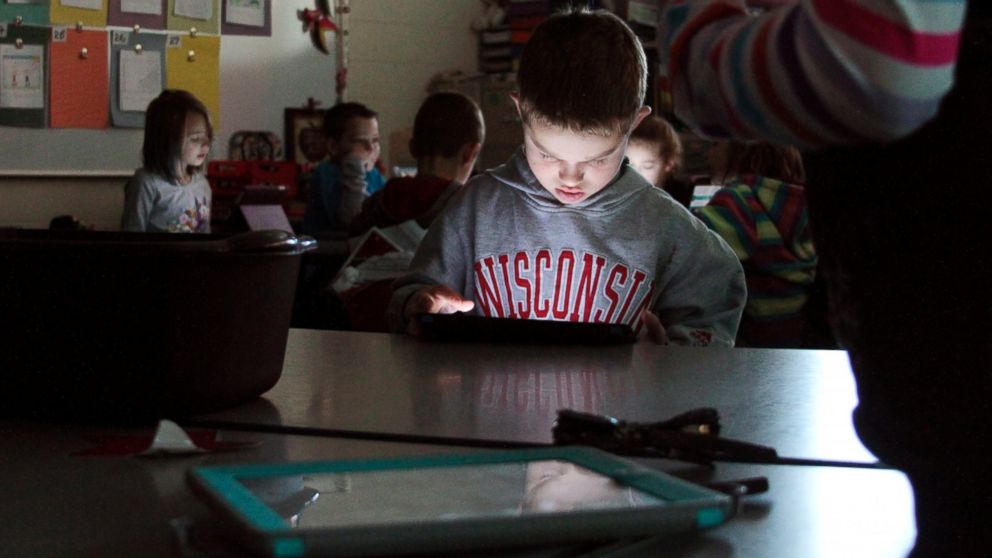 Friess Lake third-grade student Jacob Lorbecki, 8, loads his coding program as part of the Hour of Code event in Richfield, Wis., Dec. 11, 2014.