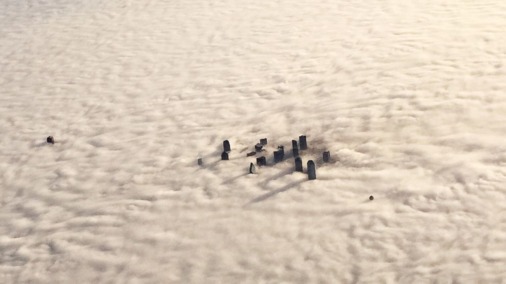In this aerial photo, downtown Dallas is enveloped in morning fog, Dec. 9, 2014. 
