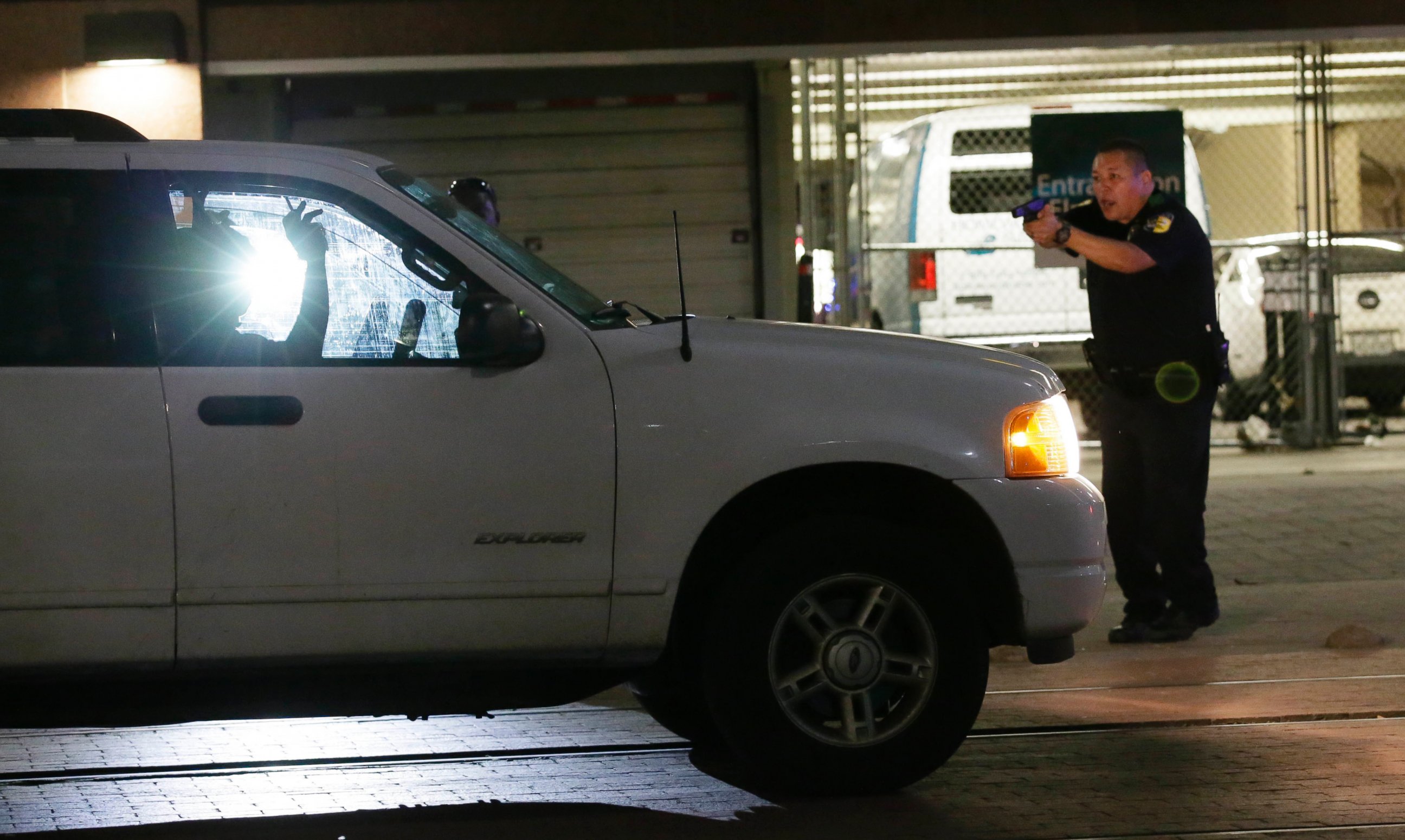 PHOTO: Dallas police stop a driver in downtown Dallas, July 7, 2016, following shootings of police officers.