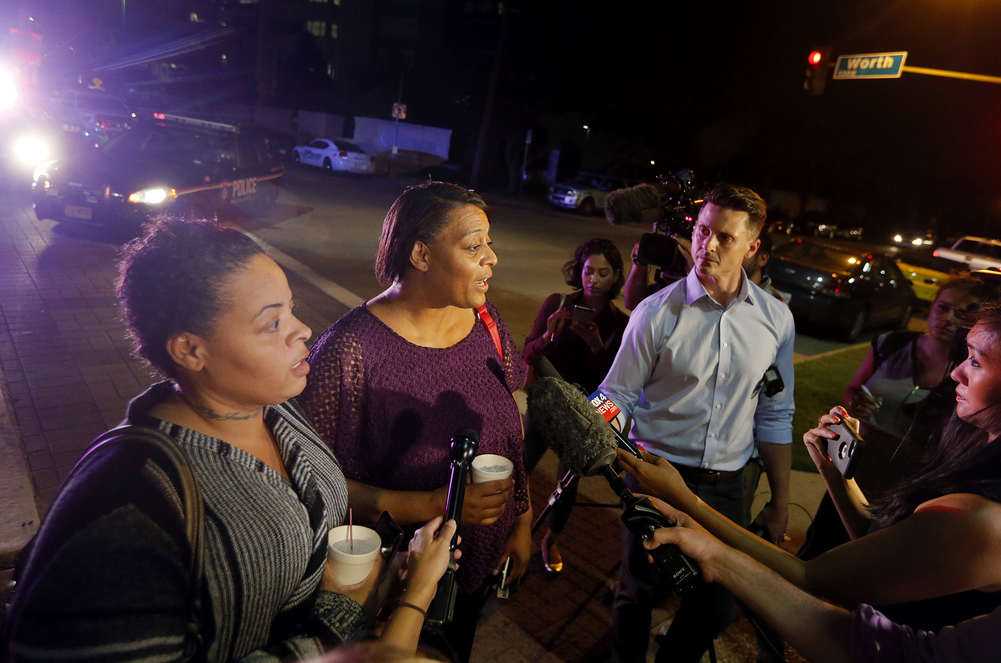 PHOTO: Sherie Williams, left, and Theresa Williams, center, speak to reporters outside Baylor University Medical Center, Friday, July 8, 2016, in Dallas, Texas. Theresa Williams said her sister Shetamia Taylor, was shot in the leg.