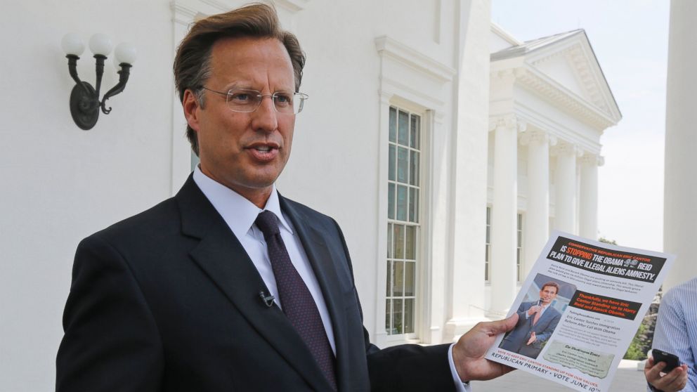 Seventh District US Congressional Republican candidate, David Brat displays an immigration mailer by Congressman Eric Cantor during a press conference at the Capitol in Richmond, Va., in this May 28, 2014 file photo. 