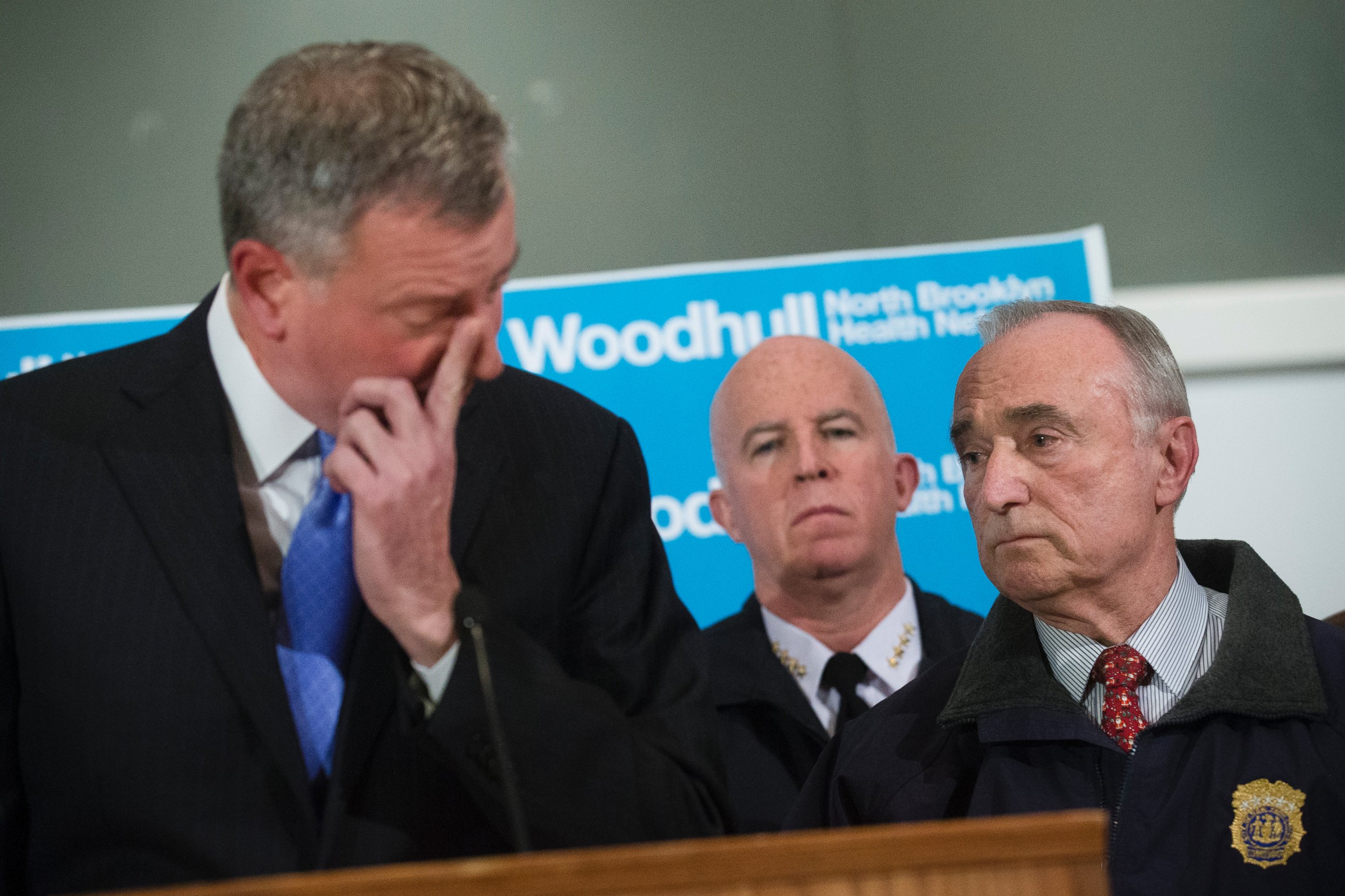 PHOTO: NYPD Commissioner Bill Bratton, right, stands beside Mayor Bill de Blasio as he wipes his eye during a news conference at Woodhull Medical Center, Saturday, Dec. 20, 2014, in New York.