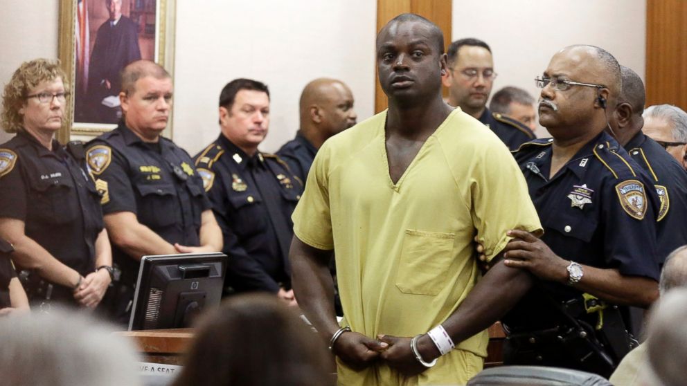 Shannon Miles is escorted out of a courtroom after a hearing, Aug. 31, 2015, in Houston. Miles has been charged with capital murder in the death of Harris County Sheriff's Deputy Darren Goforth.