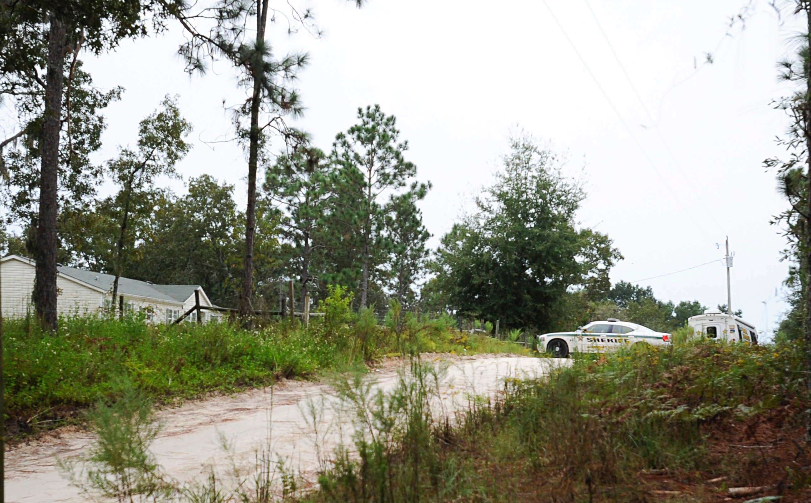 PHOTO: A Gilchrist County sheriff's vehicle sits on the property, Sept. 19, 2014, where 51-year-old Don Spirit allegedly shot and killed his adult daughter and six of his grandchildren, as well as himself in Bell, Fla.