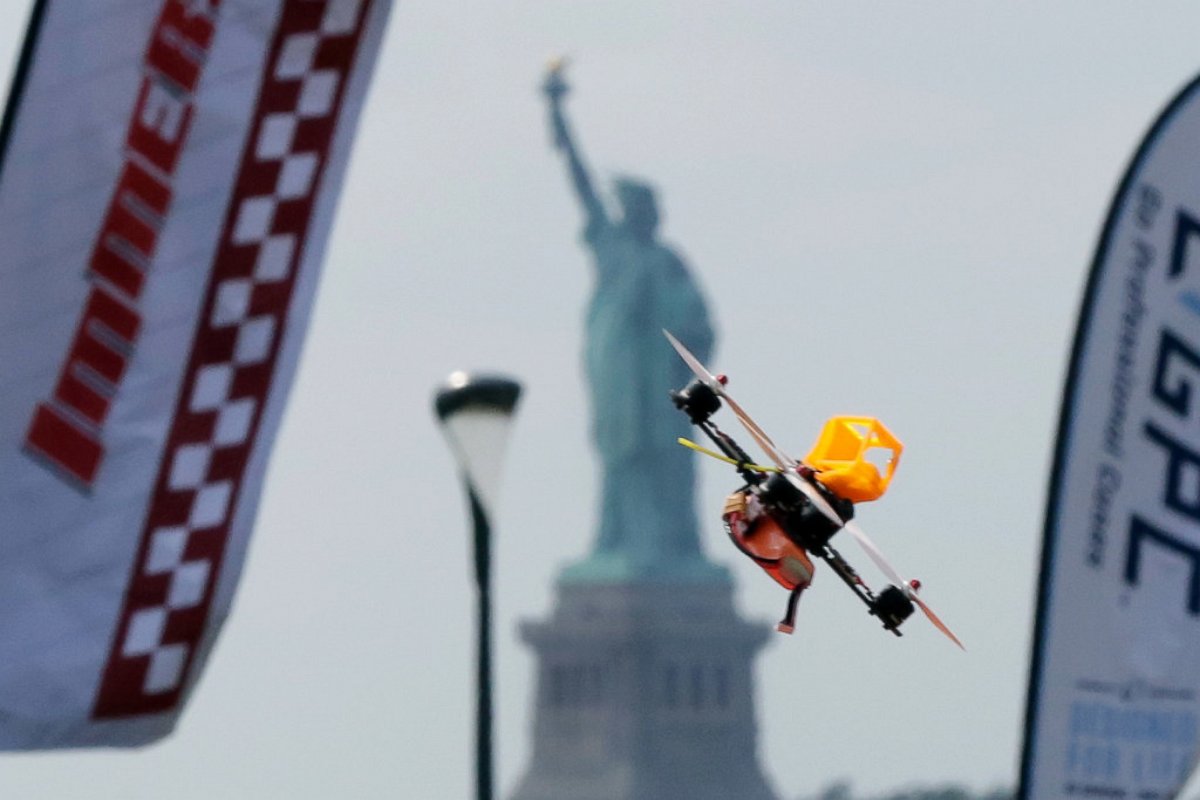 PHOTO: A pilot flies a small racing drone through an obstacle course on Governors Island, a former military installation in New York Harbor, Aug. 5, 2016. Drone pilots are gathering in New York City to compete in the National Drone Racing Championship.