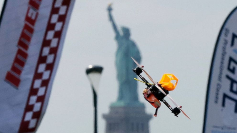 PHOTO: A pilot flies a small racing drone through an obstacle course on Governors Island, a former military installation in New York Harbor, Aug. 5, 2016. Drone pilots are gathering in New York City to compete in the National Drone Racing Championship.