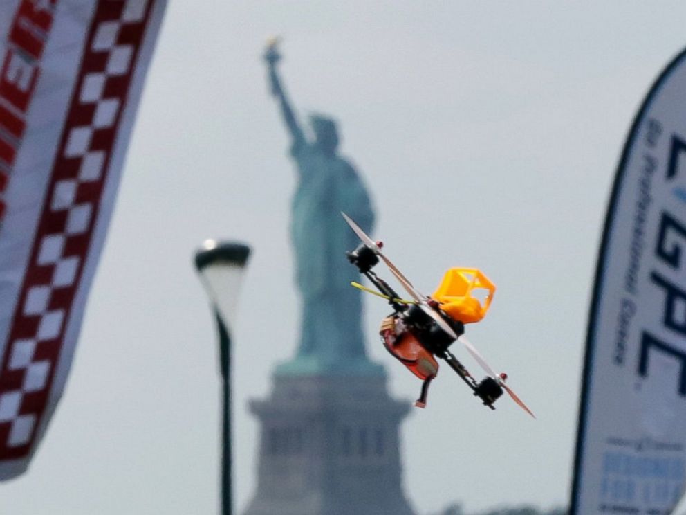 PHOTO: A pilot flies a small racing drone through an obstacle course on Governors Island, a former military installation in New York Harbor, Aug. 5, 2016. Drone pilots are gathering in New York City to compete in the National Drone Racing Championship.