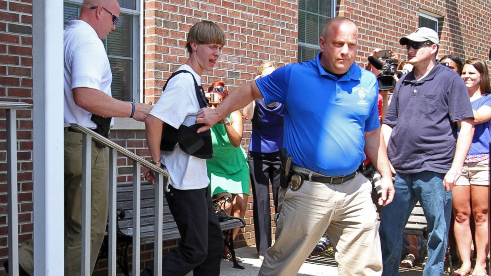 PHOTO: Charleston, S.C., shooting suspect Dylann Storm Roof, second from left, is escorted from the Shelby Police Department in Shelby, N.C., June 18, 2015. 