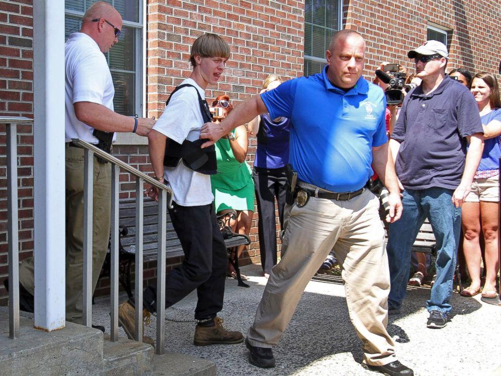 PHOTO: Charleston, S.C., shooting suspect Dylann Storm Roof, second from left, is escorted from the Shelby Police Department in Shelby, N.C., June 18, 2015.
