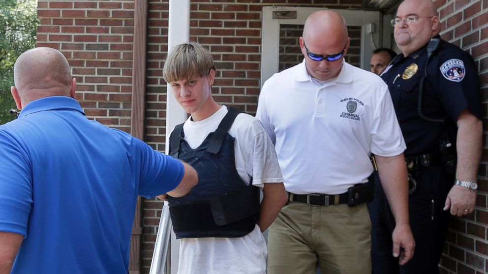PHOTO: Charleston, S.C., shooting suspect Dylann Storm Roof, center, is escorted from the Sheby Police Department in Shelby, N.C., June 18, 2015. 