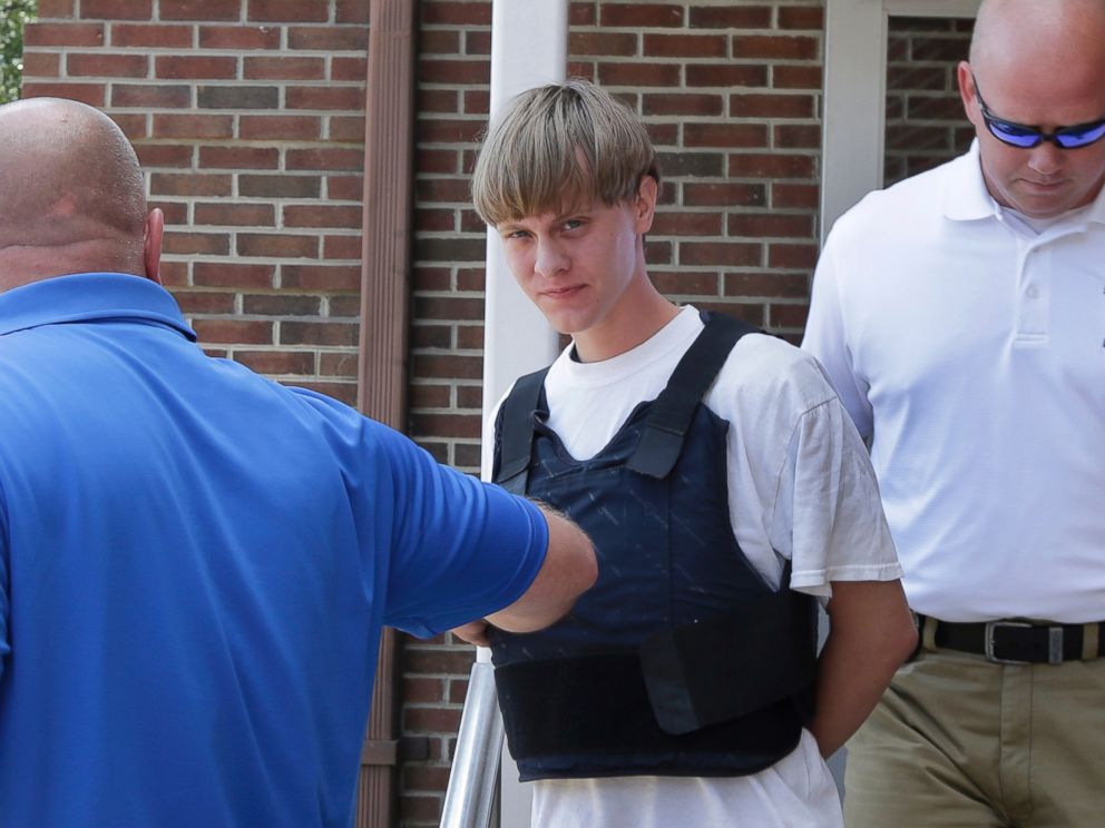 PHOTO: Charleston, S.C., shooting suspect Dylann Storm Roof, center, is escorted from the Sheby Police Department in Shelby, N.C., June 18, 2015. 