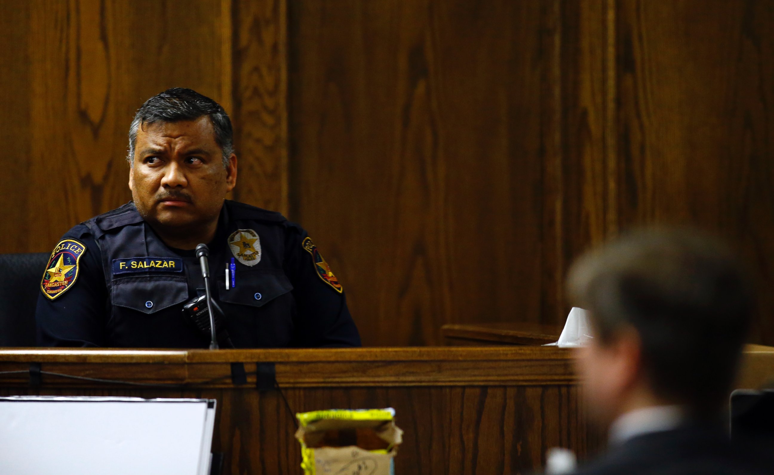 PHOTO: Lancaster police officer Flavio Salazar listens to a question from the defense during the capital murder trial of former Marine Cpl. Eddie Ray Routh in Stephenville, Texas on Feb. 17, 2015.