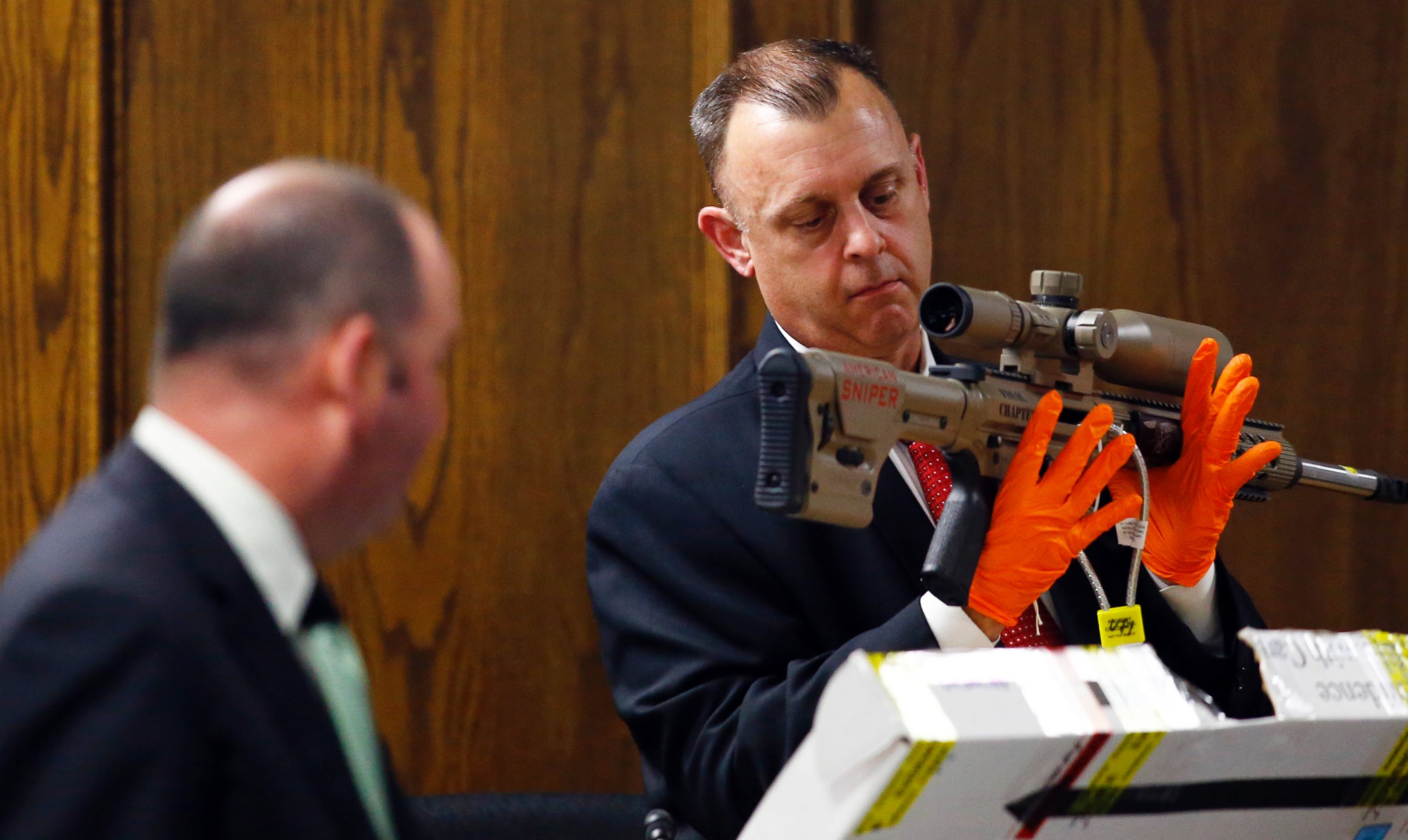 PHOTO: Texas Ranger Michael Adcock holds a rifle with the lettering "American Sniper" marked on the side during the capital murder trial of former Marine Cpl. Eddie Ray Routh in Stephenville, Texas on Feb. 17, 2015.