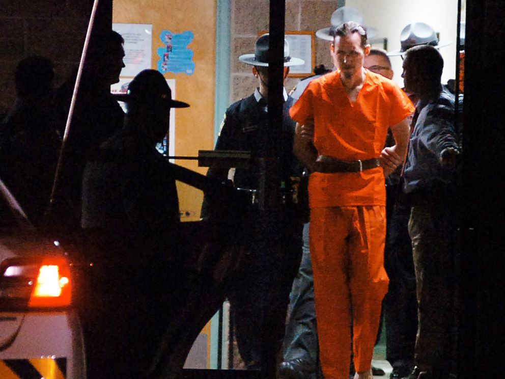 PHOTO: Pennsylvania State Police Troopers take away suspected killer Eric Frein from the Blooming Grove State Police barracks, Oct. 31, 2014, in Blooming Grove Township, Pennsylvania.