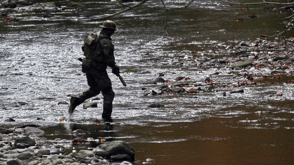 PHOTO: A U.S. Marshal patrols along Mill Creek in Barrett Township, Pa., on Sept 29, 2014.