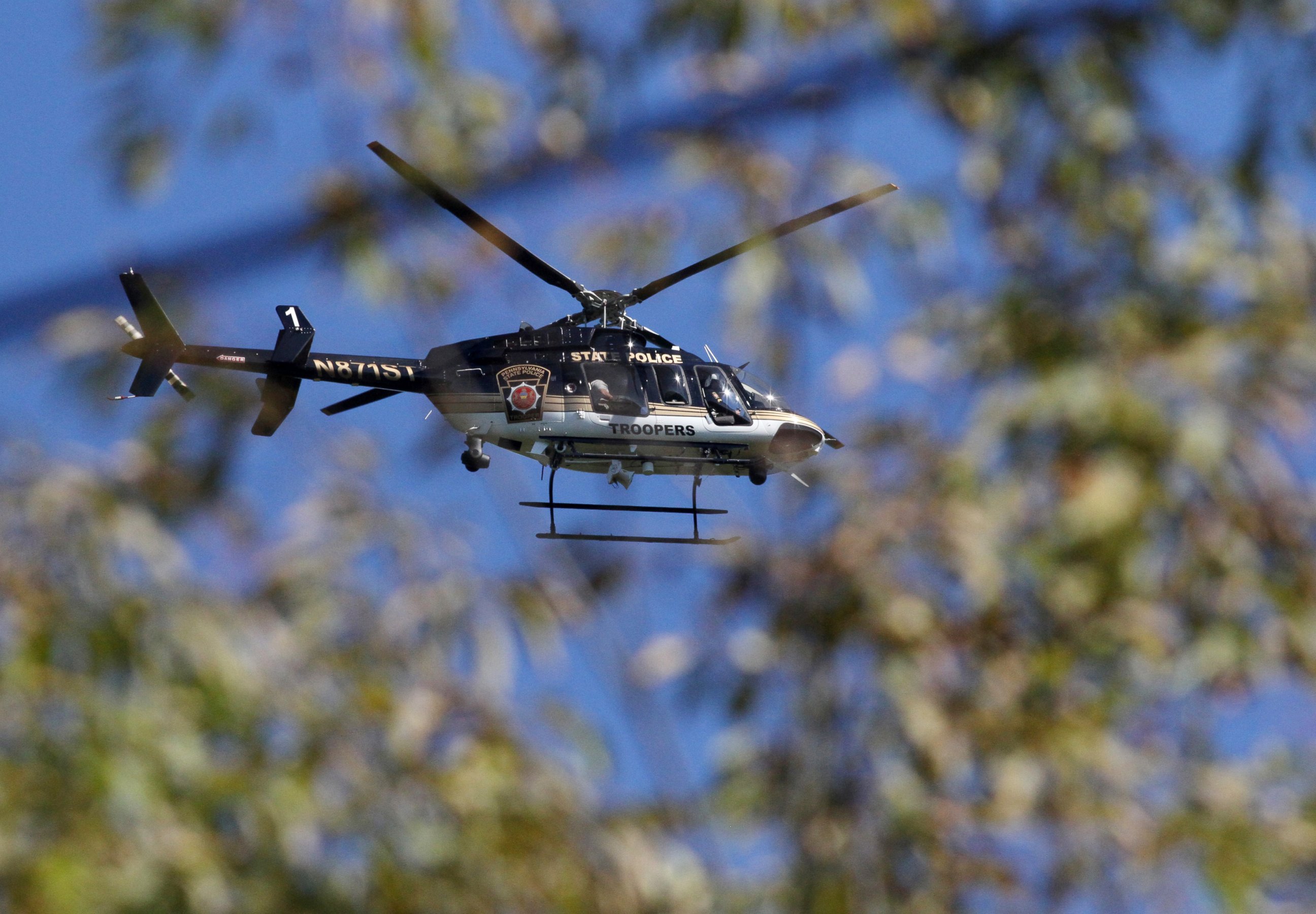 PHOTO: A Pennsylvania State Police helicopter searches for Eric Frein near Canadensis, Pa., on Sept 23, 2014.