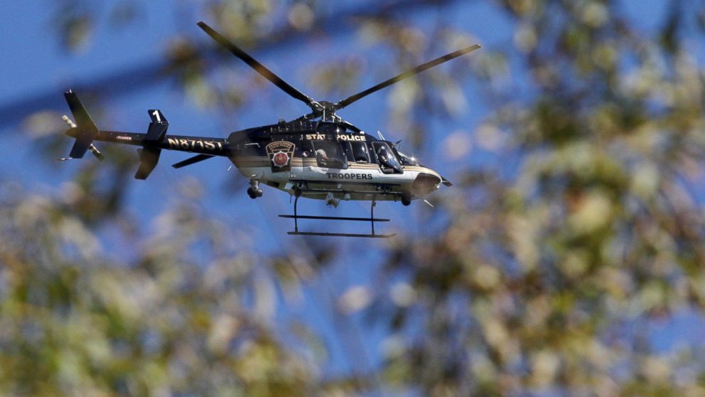 PHOTO: A Pennsylvania State Police helicopter searches for Eric Frein near Canadensis, Pa., on Sept 23, 2014.