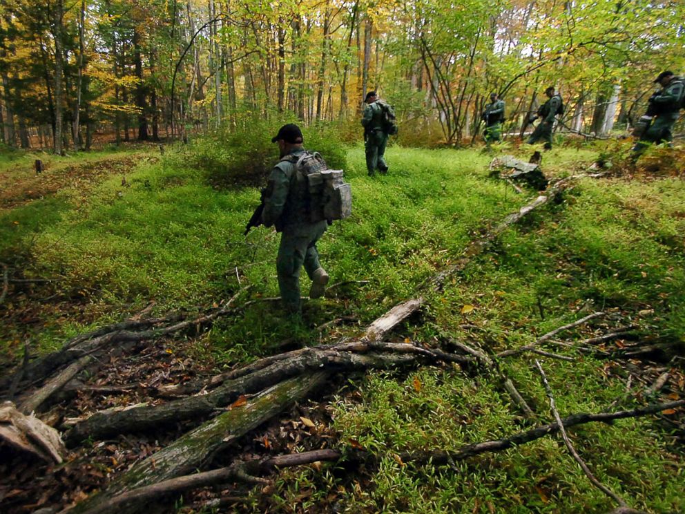 PHOTO: Members of the Scranton Police Special Operations Group search the woods, Oct. 2, 2014, in Barrett Township near Canadensis, Pa., for suspected killer Eric Frein.