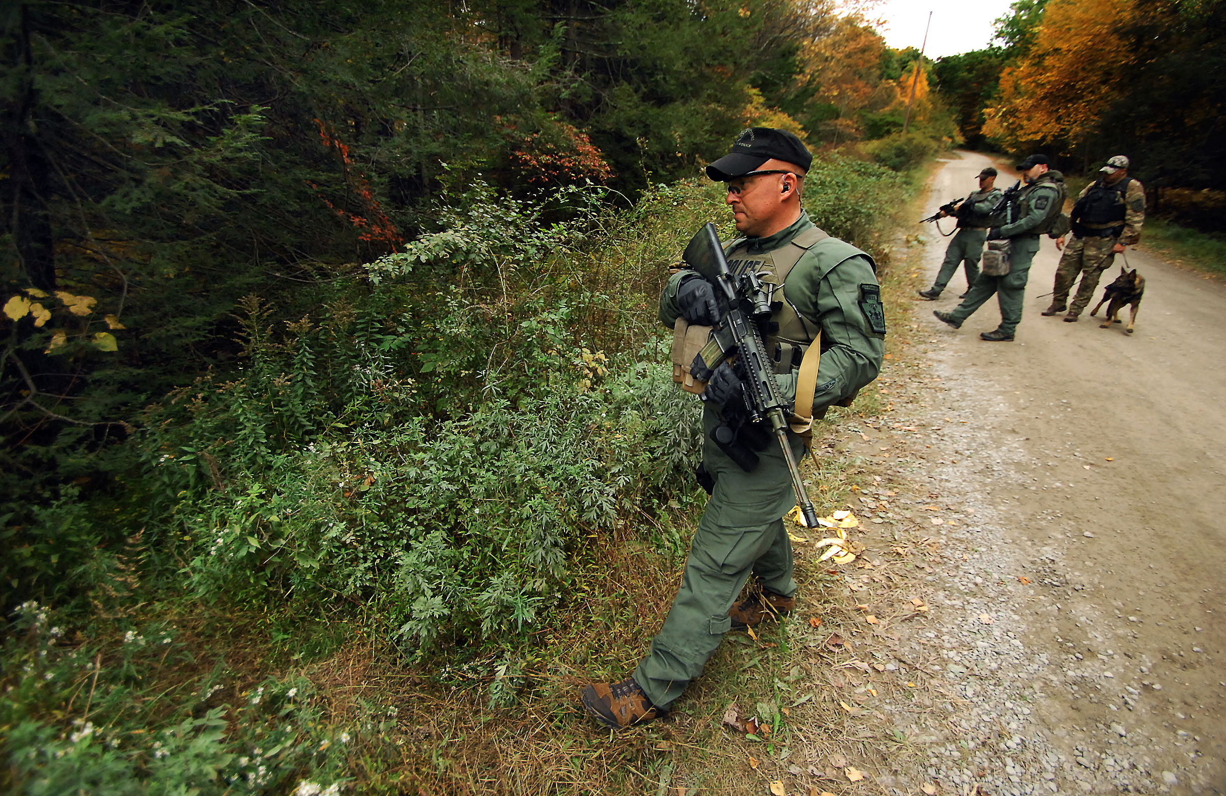 PHOTO: A member of the Scranton, Pa., Police Special Operations Group, prepares to ender the woods, Oct. 2, 2014, in Barrett Township, Pa., to search for suspected killer Eric Frein. 