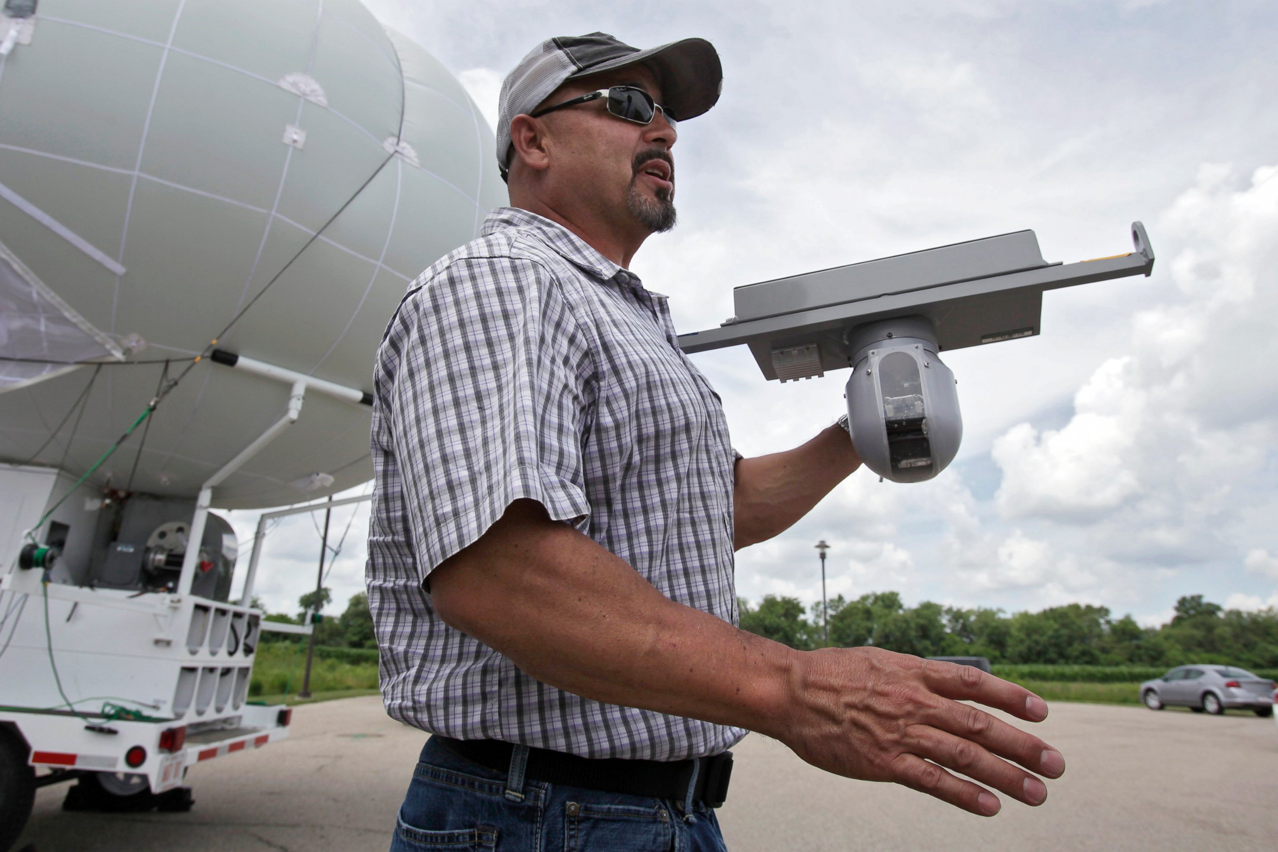 PHOTO: In this June 26, 2014 photo, Rob King shows off the sensor that attaches to the bottom of a surveillance blimp, a large helium balloon that has cameras attached, at Ohio/Indiana Unmanned Aircraft Systems Center in Clintonville, Ohio. 