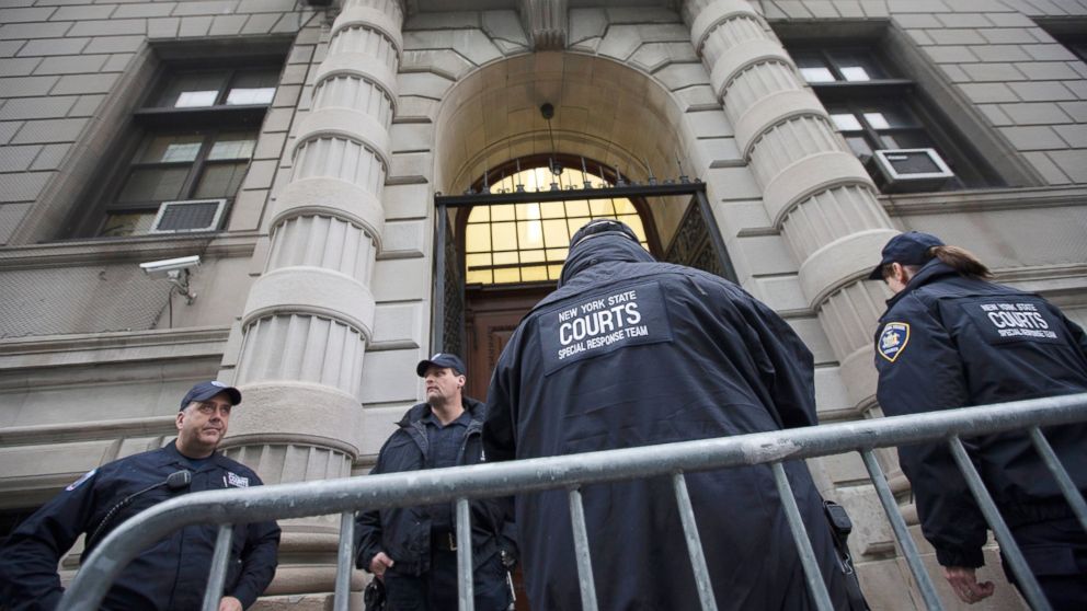Security personnel stand outside Richmond County Supreme Court after a grand jury's decision not to indict a New York police officer involved in the death of Eric Garner, Dec. 3, 2014.