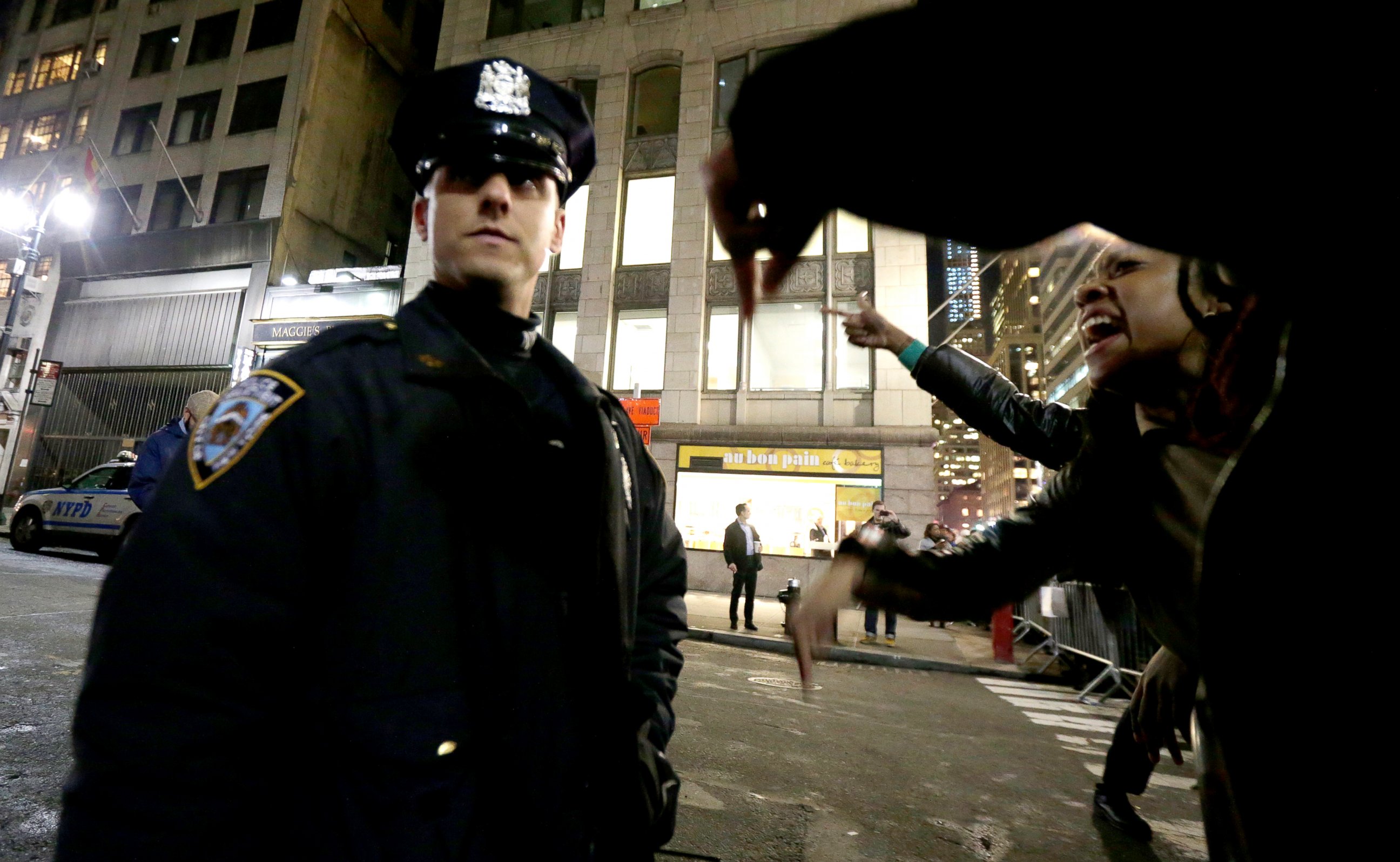 PHOTO: A woman yells at a New York City Police officer during a protest after it was announced that the officer involved in the death of Eric Garner is not being indicted, Dec. 3, 2014, in New York.