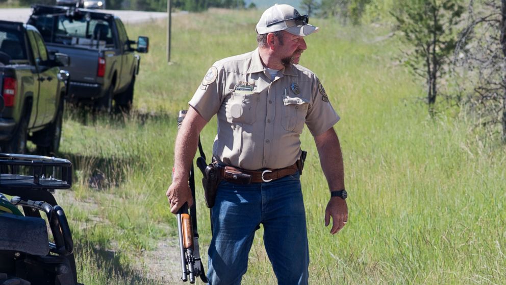 PHOTO: Montana Fish, Wildlife and Parks game warden Perry Brown prepares to hunt for a grizzly bear that killed Forest Service law enforcement officer Brad Treat near West Glacier, Mont. on Wednesday, June 29, 2016.