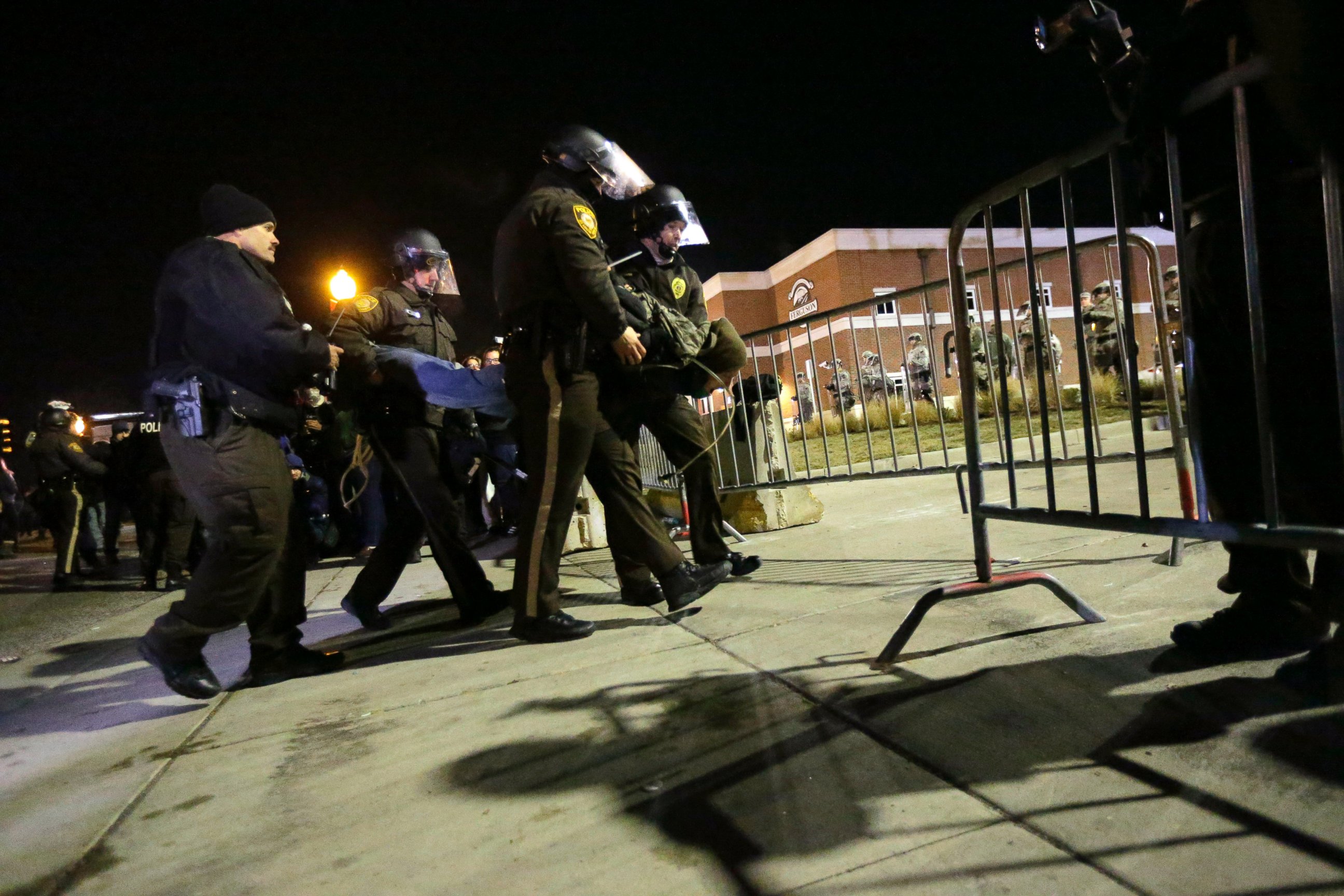 PHOTO: Police take a protester into custody Tuesday, Nov. 25, 2014, in Ferguson, Mo.