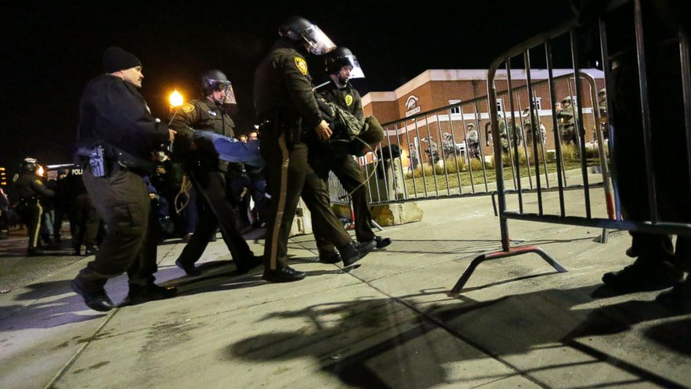 PHOTO: Police take a protester into custody Tuesday, Nov. 25, 2014, in Ferguson, Mo.