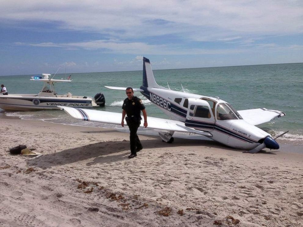 PHOTO: This Sunday, July 27, 2014, photo provided by the Sarasota County Sheriff's Office shows emergency personnel at the scene of a small plane crash in Caspersen Beach in Venice, Fla.