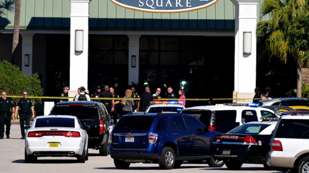 Emergency personnel respond to the scene of a shooting at the Melbourne Square Mall on Jan 17, 2015 in Melbourne, Fla. Melbourne Police have confirmed that the shooting Saturday morning at the mall has left two people dead and one injured from a gunshot wound. Police say the injured victim is hospitalized in stable condition and cooperating with investigators. After responding to reports around 9:30 a.m. of multiple shots fired inside the mall, police tweeted that the "shooter is contained." (AP Photo/Florida Today, Malcolm Denemark)  NO SALES