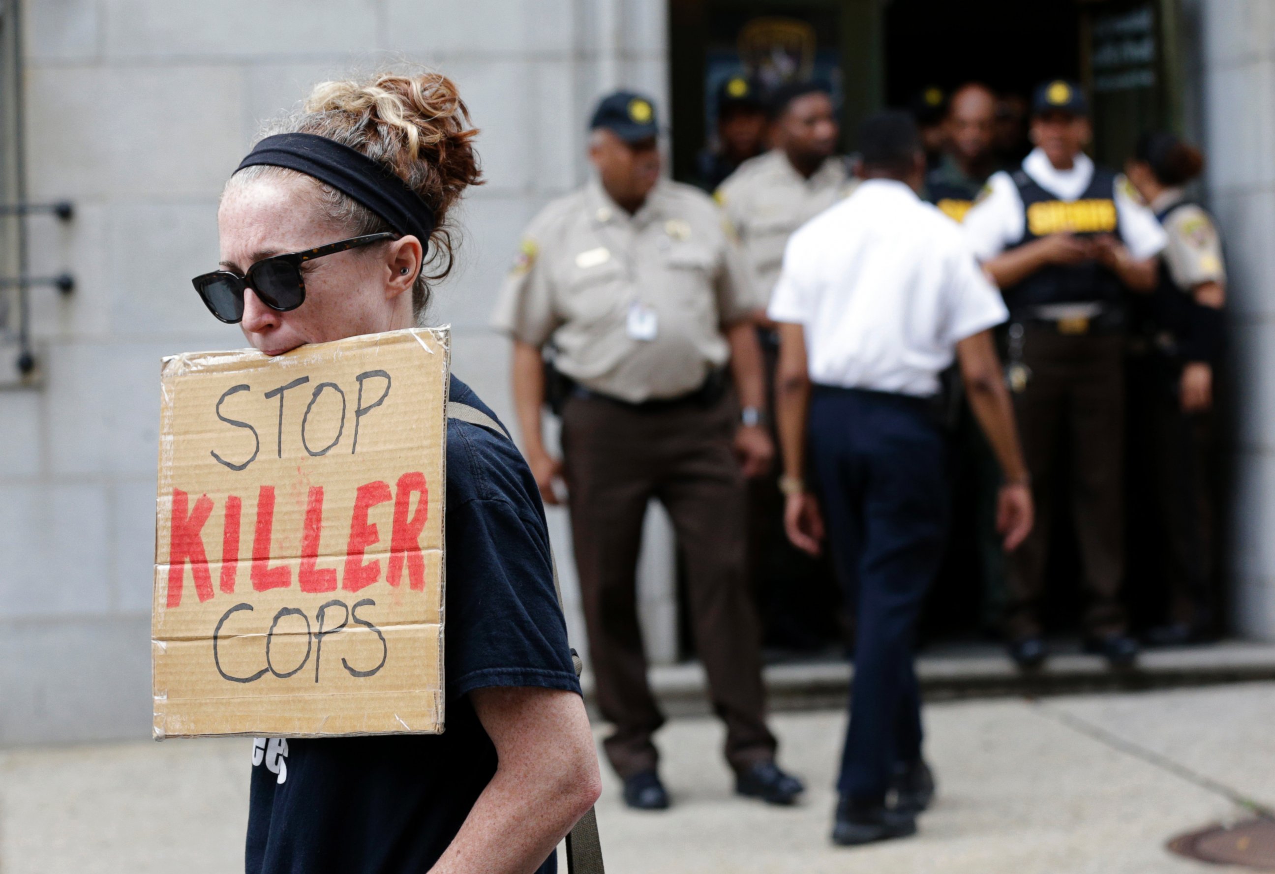 PHOTO: A protester displays a sign outside a courthouse after Officer Caesar Goodson was acquitted of all charges in his trial in Baltimore, June 23, 2016.