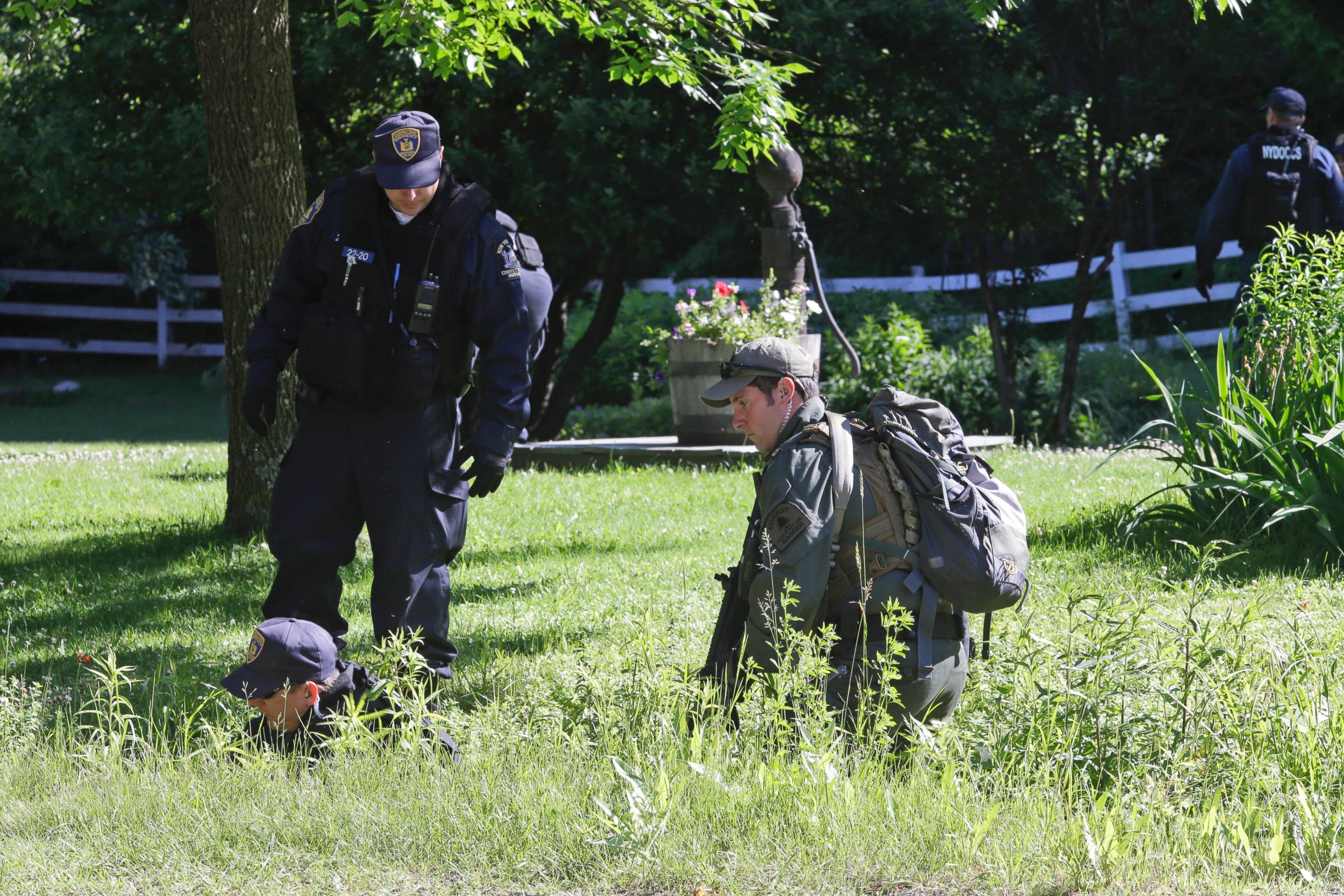 PHOTO: New York State Department of Corrections Officers and a forest ranger patrol an area in Owls Head, N.Y. for convicted murderers Richard Matt and David Sweat, June 26, 2015.