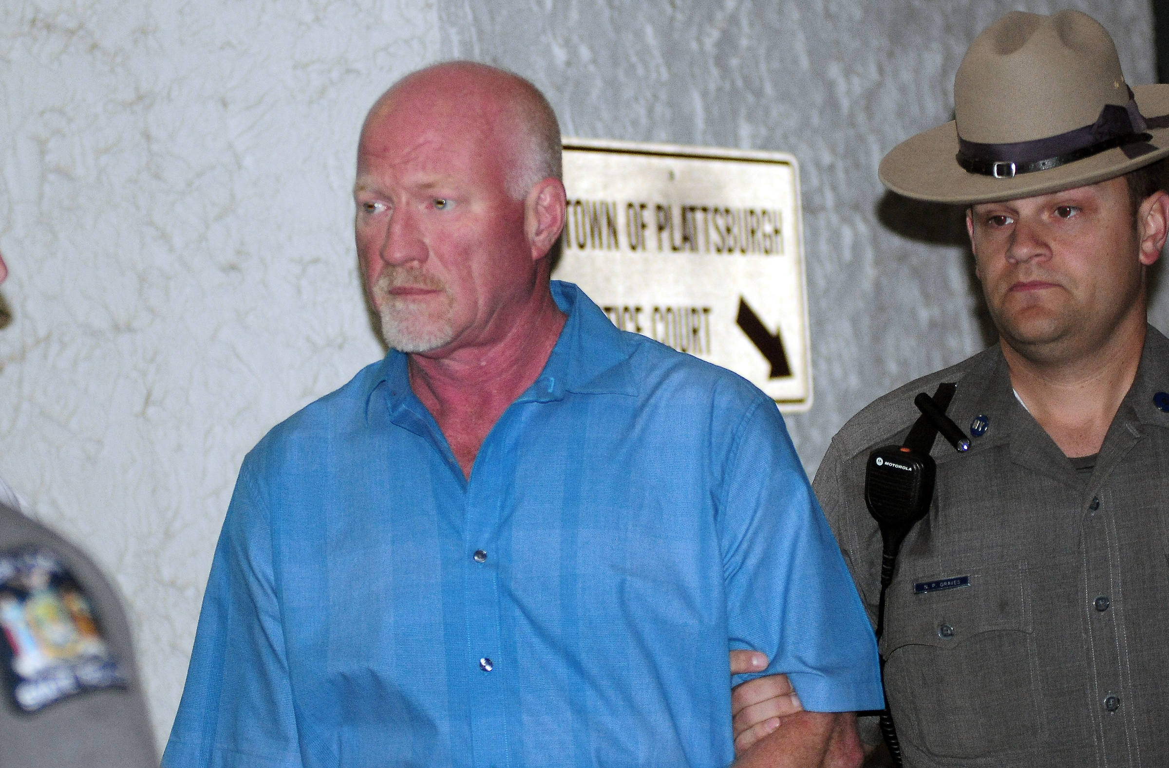 PHOTO: A New York State Police officer escorts suspended Clinton Correctional Facility guard Gene Palmer from Plattsburgh Town Court in Plattsburgh, N.Y., June 24, 2015.