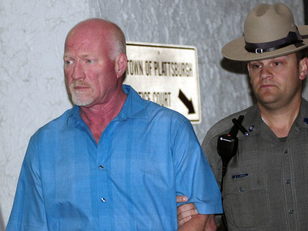 PHOTO: A New York State Police officer escorts suspended Clinton Correctional Facility guard Gene Palmer from Plattsburgh Town Court in Plattsburgh, N.Y., June 24, 2015.
