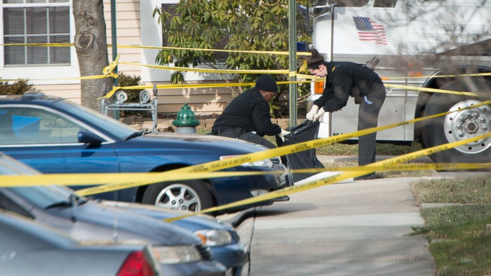 Police investigate a homicide on Jan. 17, 2013 in Germantown, Md. Police who went into a home in Germantown encountered a "very bloody scene" and discovered two children believed to be under the age of 10 dead, and two other children and a woman injured.