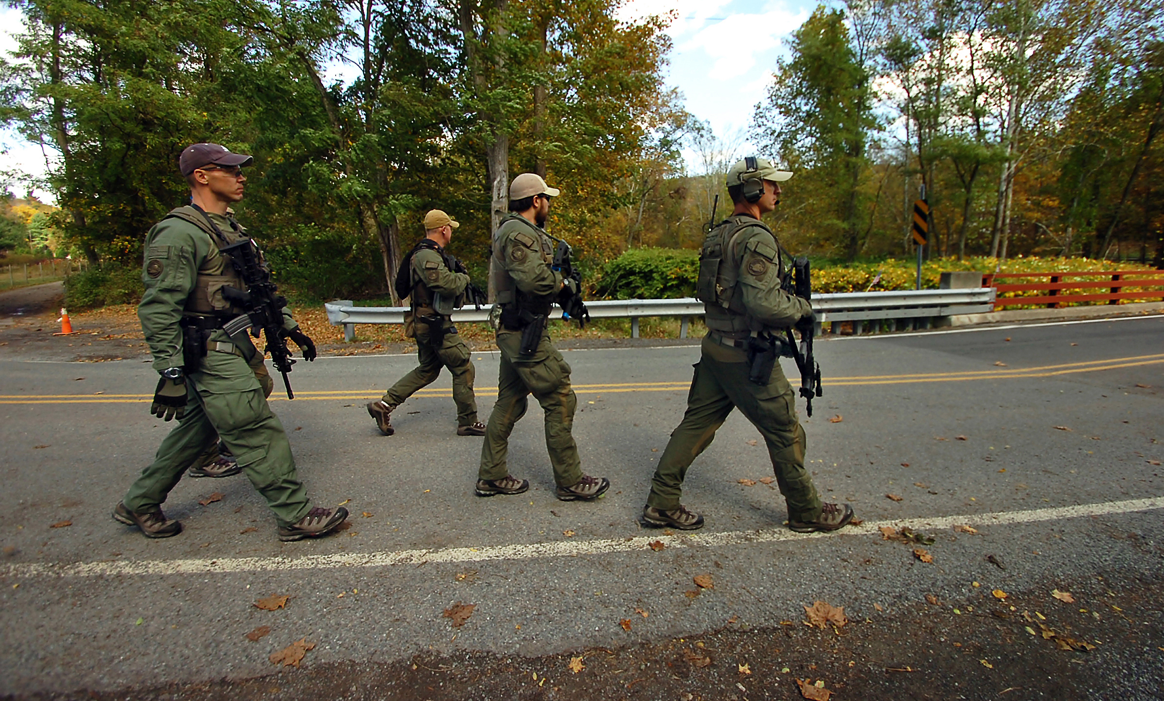PHOTO: Members of the FBI SWAT team walk to the woods Oct. 8, 2014 in Price Township near Canadensis, Pa., searching for killer Eric Frein.