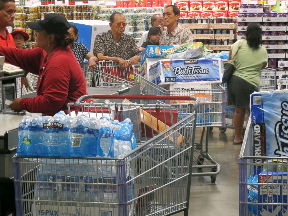 PHOTO: Shoppers stock up on cases of bottled water and other supplies in preparation for a hurricane and tropical storm heading toward Hawaii at the Iwilei Costco in Honolulu on Tuesday, Aug. 5, 2014.