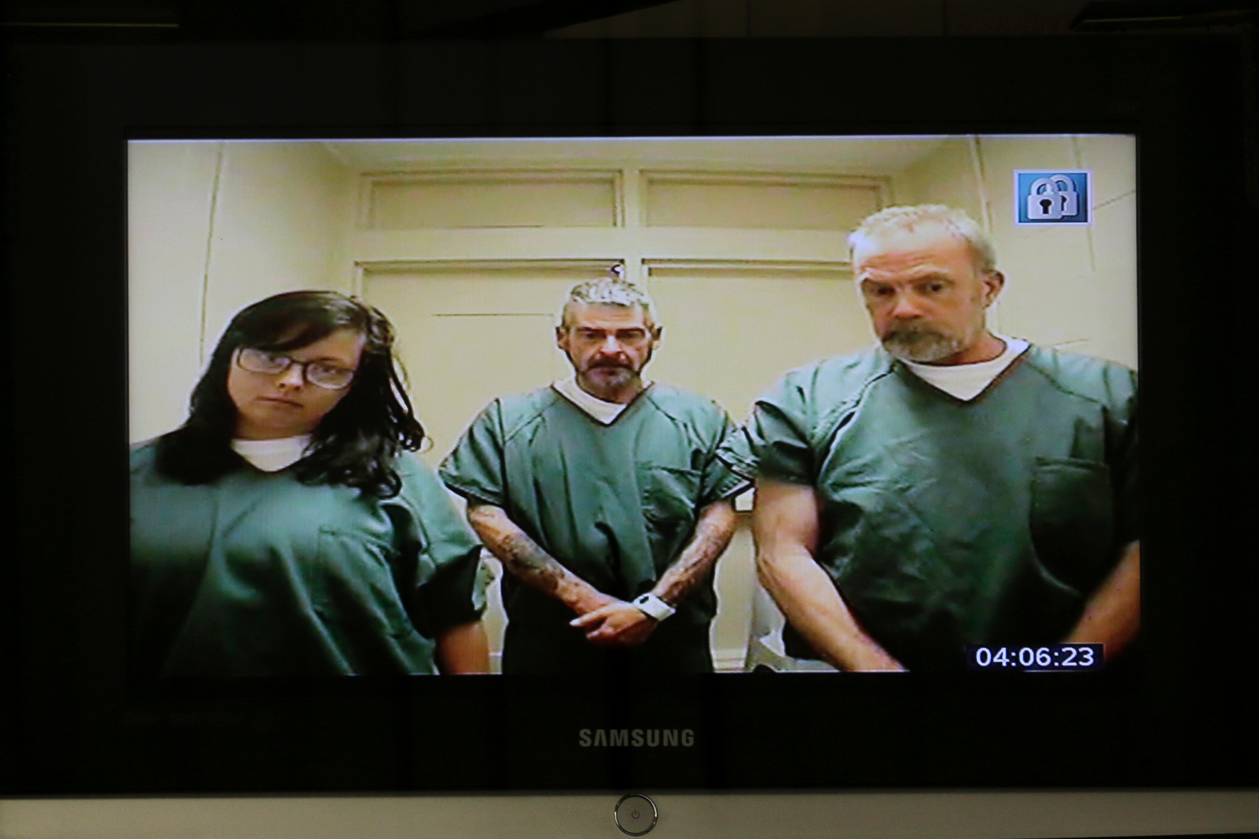 PHOTO: Kimberly Arendt, John Cramsey and Dean Smith are seen on a monitor during their video arraignment at Hudson County Courthouse, Wednesday, June 22, 2016, in Jersey City, N.J.