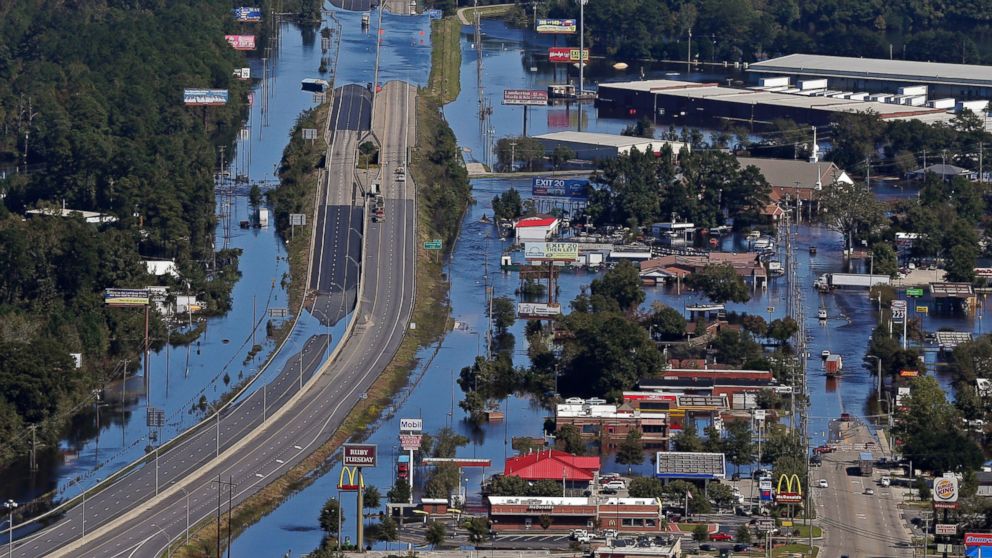 PHOTO: Floodwaters from Hurricane Matthew covers Interstate 95 and homes and businesses in Lumberton, North Carolina, Oct. 12, 2016.