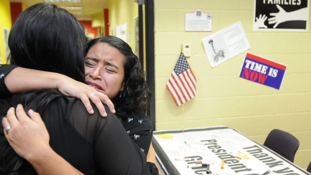 PHOTO: Laura Moreno, of Nampa, hugs her good friend Krista Busmante after watching President Obama's speech on immigration reform, Nov. 20, 2014 at the Hispanic Cultural Center in Nampa, Idaho.
