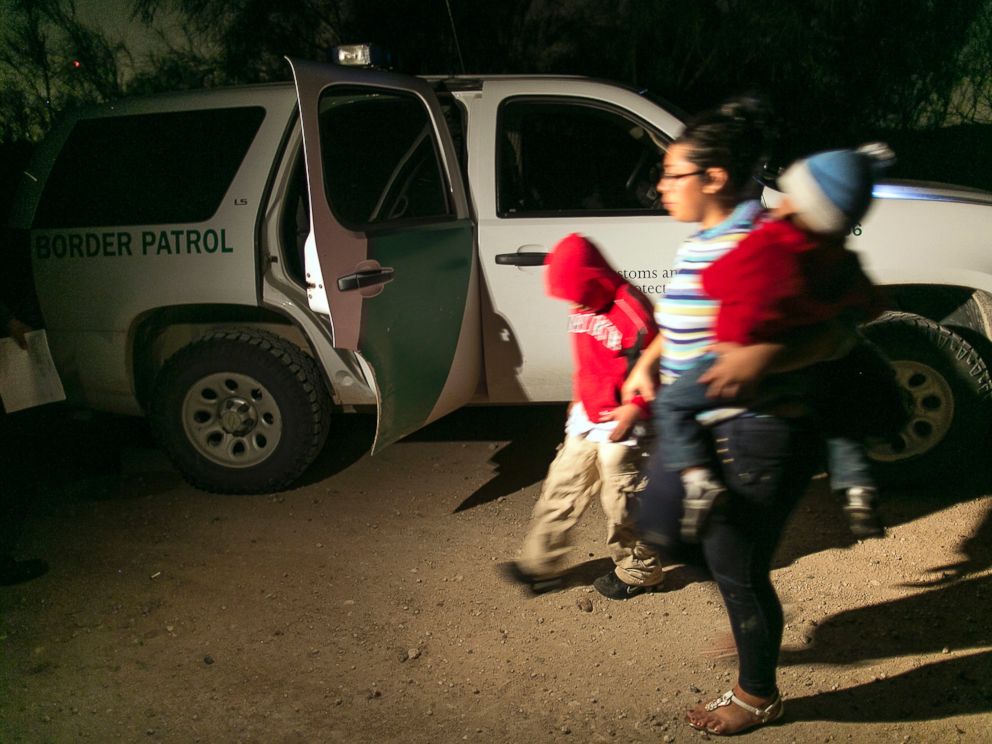 PHOTO: In this July 3, 2014 photo, a mother from Honduras traveling with her nine-year-old son and one-year-old daughter prepare to get into a U.S. Customs and Border Protection Services agents truck after crossing the Rio Grande near McAllen, Texas.