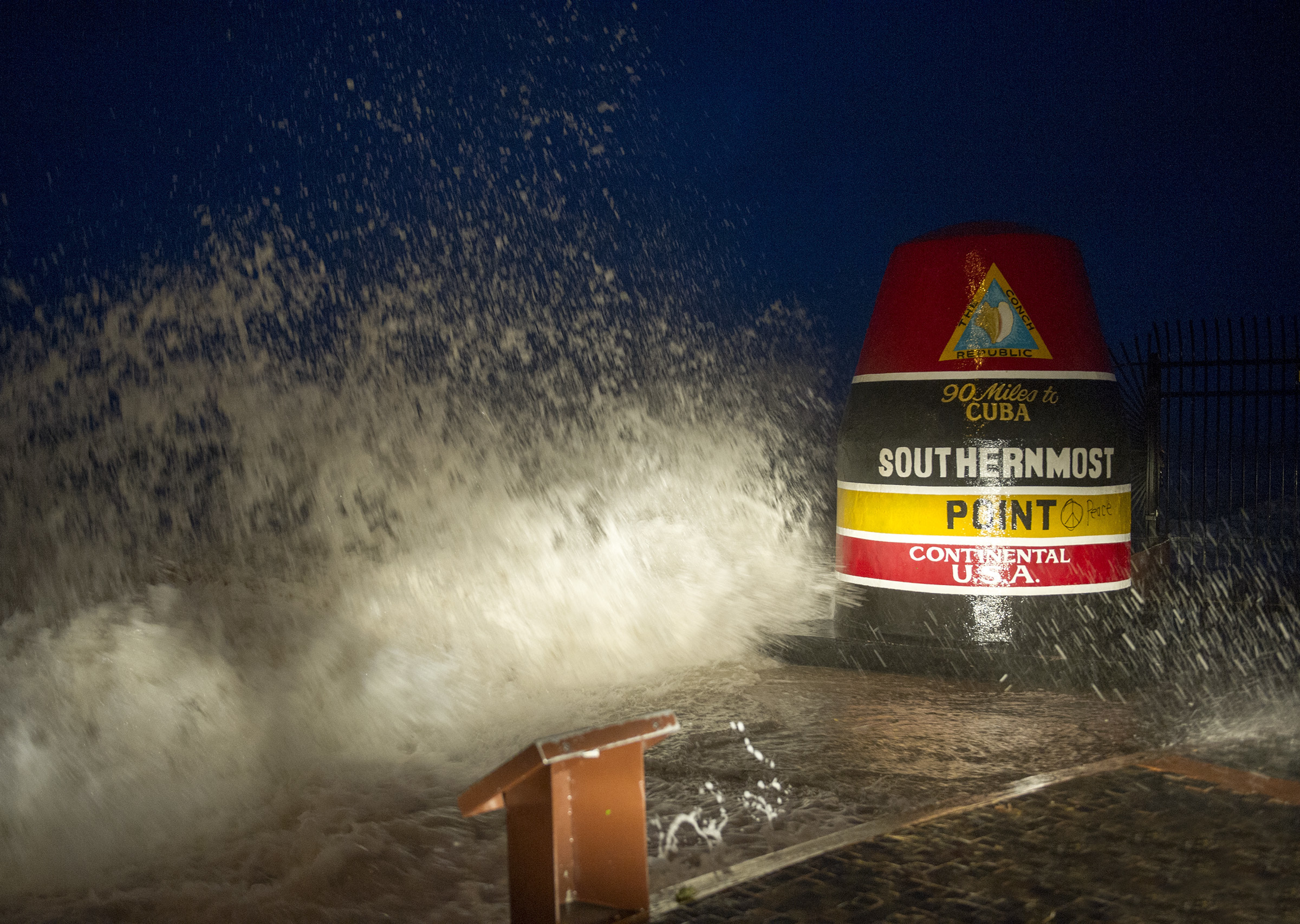 PHOTO: Waves crash against the Southernmost Point in Key West, Fla., Saturday, Sept. 9, 2017. Hurricane Irma's leading edge bent palm trees and spit rain as the storm swirled toward Florida on Saturday. 